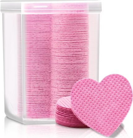 A clear plastic box containing 200 pink heart-shaped lint-free wipes, suitable for lash extensions and nail polish removal.