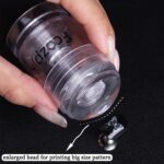 Fcozpjk clear silicone rotatable nail art stamper and scraper kit, showing the stamper's adjustable base.