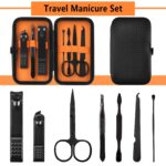 Open black and orange fenlebeneil 7-piece manicure set with nail clippers, scissors, tweezers, and other grooming tools displ