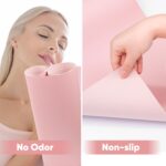 Pink microfiber PU leather nail art table mat rolled up with a strap, next to the mat unrolled showing its texture.
