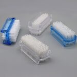 Four Xjinmin two-sided nail scrub brushes, two blue and two white, shown in a clean arrangement.